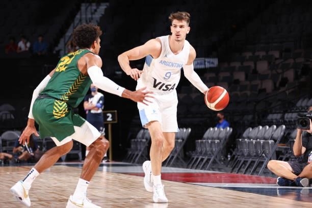 Nicolas Brussino of the Argentina Men's National Team handles the ball during the game as Matisse Thybulle of the Australia Men's National Team plays...