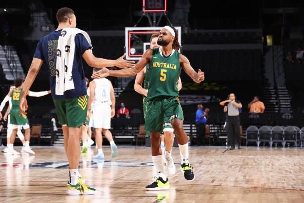 Patty Mills of the Australia Men's National Team high fives Dante Exum of the Australia Men's National Team after the game against the Argentina...
