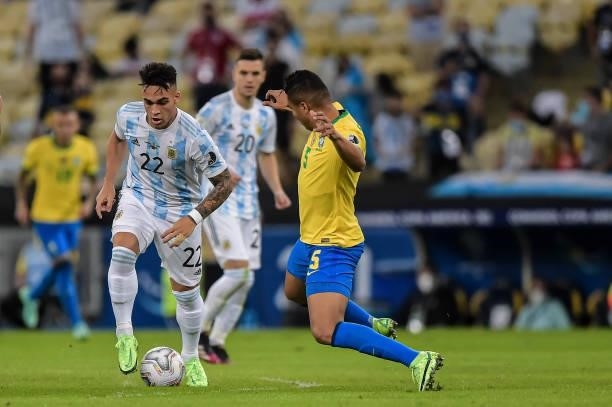 Casemiro player from Brazil disputes a bid with Lautaro Martinez player from Argentina during a match at the Maracana stadium for the Copa America...