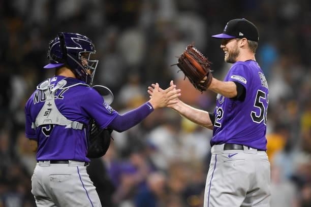 Daniel Bard of the Colorado Rockies is congratulated by Dom Nunez after the Rockies beat the San Diego Padres 3-0 in a baseball game at Petco Park on...