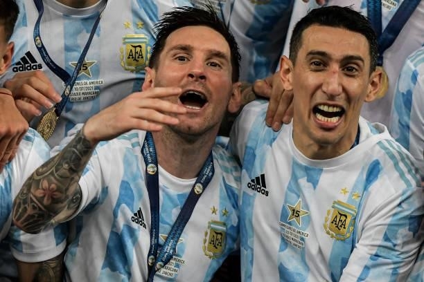 Messi e Di Maria player from Argentina lifts the champion's cup during an award ceremony at the end of the match against Brazil at the Maracana...
