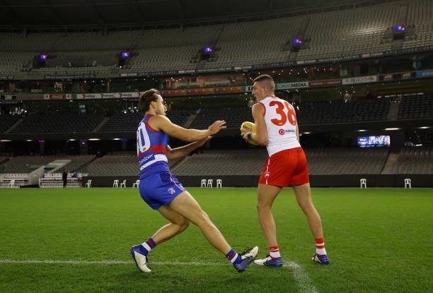 Colin O'Riordan of the Swans and Lachlan McNeil of the Bulldogs train together after the 2021 AFL Round 17 match between the Western Bulldogs and the...