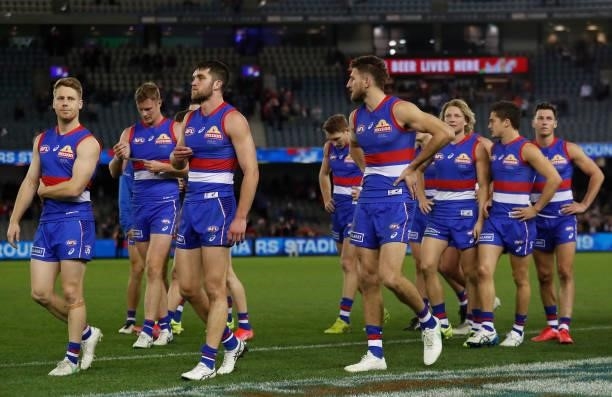 The Bulldogs look dejected after a loss during the 2021 AFL Round 17 match between the Western Bulldogs and the Sydney Swans at Marvel Stadium on...