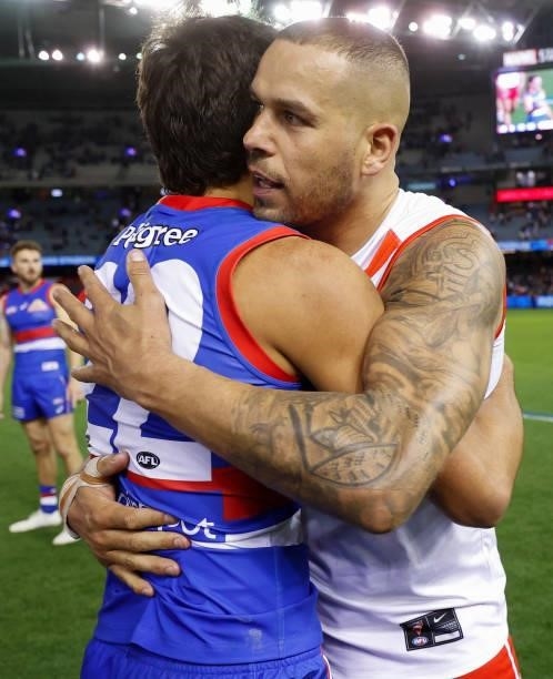 Jamarra Ugle-Hagan of the Bulldogs and Lance Franklin of the Swans embrace after the 2021 AFL Round 17 match between the Western Bulldogs and the...