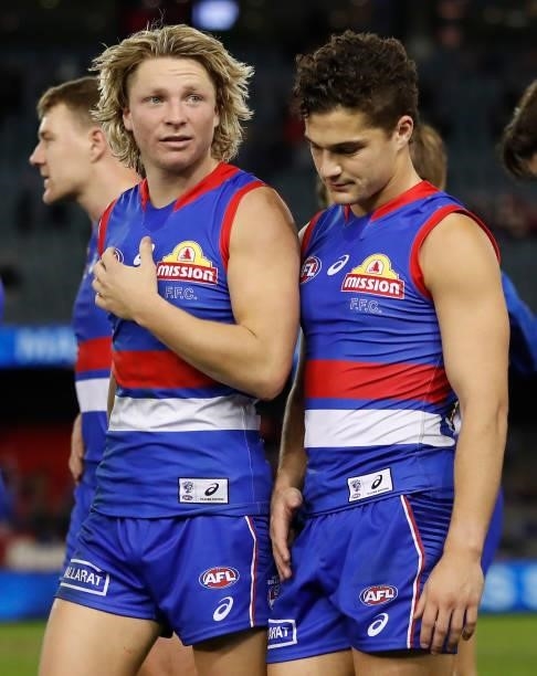 Cody Weightman and Riley Garcia of the Bulldogs look dejected after a loss during the 2021 AFL Round 17 match between the Western Bulldogs and the...