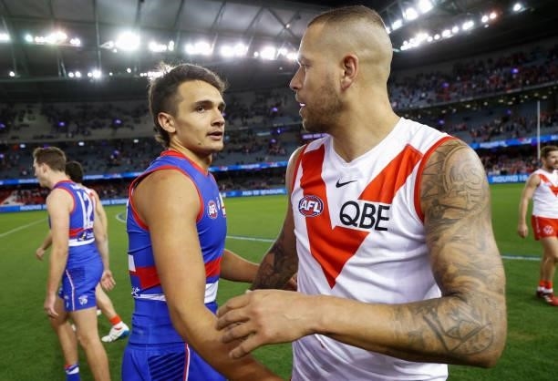 Jamarra Ugle-Hagan of the Bulldogs and Lance Franklin of the Swans embrace after the 2021 AFL Round 17 match between the Western Bulldogs and the...