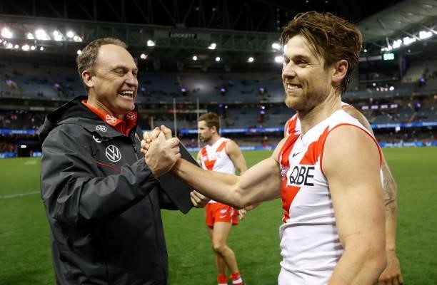 Senior coach John Longmire and Dane Rampe of the Swans celebrate during the 2021 AFL Round 17 match between the Western Bulldogs and the Sydney Swans...