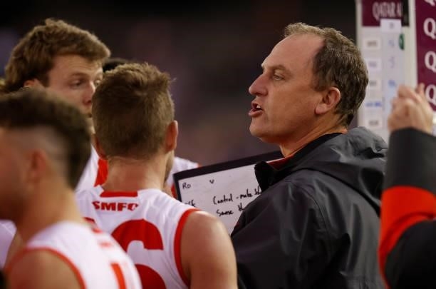 Senior coach John Longmire of the Swans addresses his players during the 2021 AFL Round 17 match between the Western Bulldogs and the Sydney Swans at...
