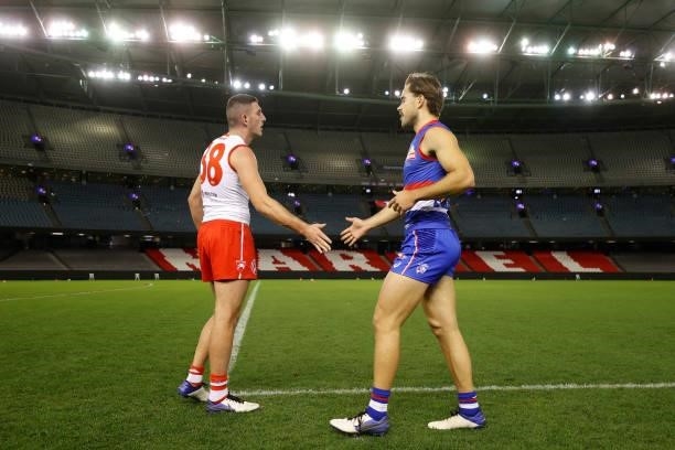 Colin O'Riordan of the Swans and Lachlan McNeil of the Bulldogs train together after the 2021 AFL Round 17 match between the Western Bulldogs and the...