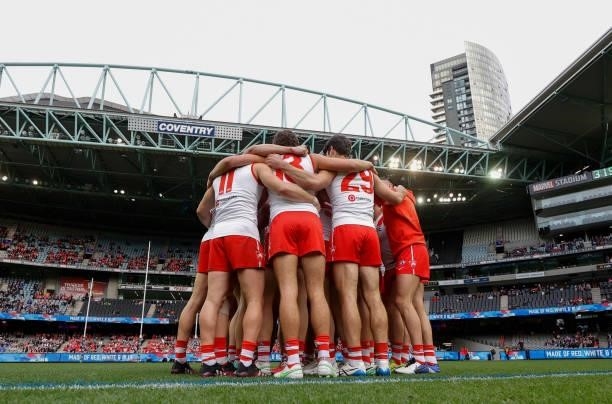 The Swans huddle during the 2021 AFL Round 17 match between the Western Bulldogs and the Sydney Swans at Marvel Stadium on July 11, 2021 in...