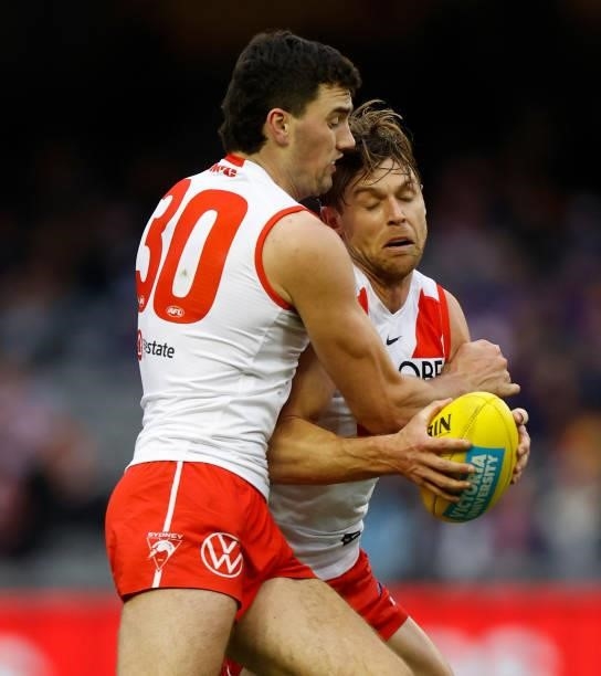 Tom McCartin and Dane Rampe of the Swans clash during the 2021 AFL Round 17 match between the Western Bulldogs and the Sydney Swans at Marvel Stadium...
