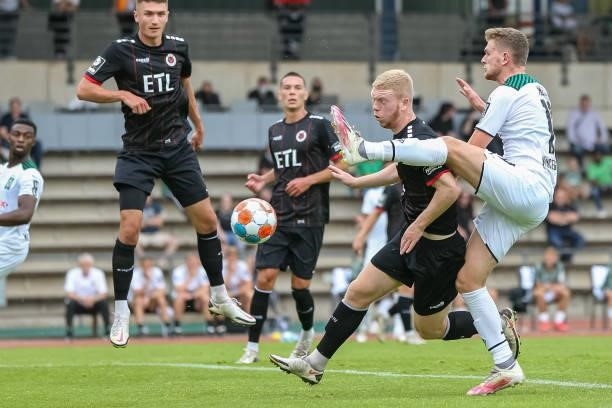 Kai Klefisch of Viktoria Koeln and Steffen Meuer of Borussia Moenchengladbach battle for the Ball during the Pre-Season Match between Borussia...