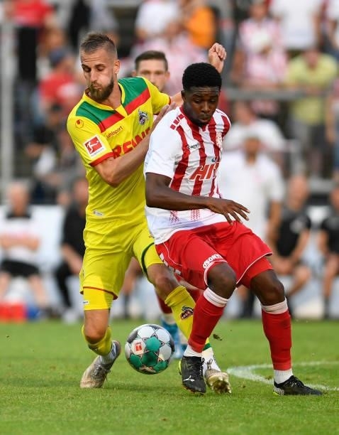 Dominick Drexler of 1. FC Koeln and Suheyel Najar of Fortuna Koeln battle for the ball during the Pre-Season Friendly match between Fortuna Koeln and...