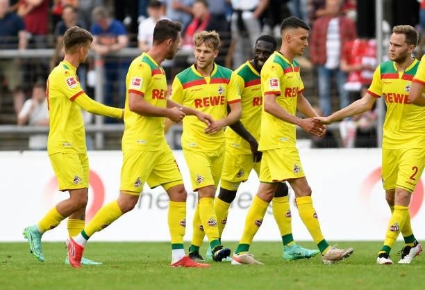 Tim Lemperle of 1. FC Koeln celebrates after scoring his teams third goal with teammates during the Pre-Season Friendly match between Fortuna Koeln...