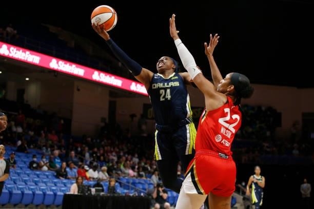 Arike Ogunbowale of the Dallas Wings drives to the basket against the Las Vegas Aces on July 11, 2021 at the College Park Center in Arlington, TX....