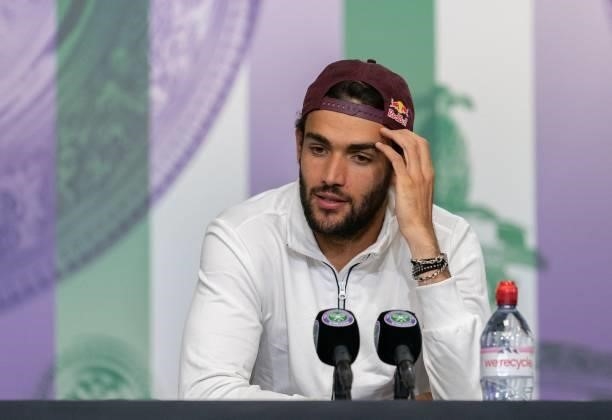 Italy's Matteo Berrettini attends a press conference after losing to Serbia's Novak Djokovic in the final of the men's singles on the thirteenth day...