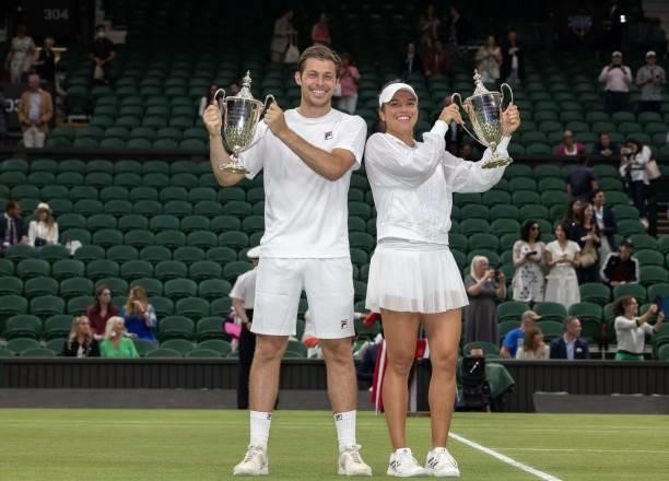 Britain's Neal Skupski and US player Desirae Krawczyk hold their trphies after their defeat of Britain's Joe Salisbury and Harriet Dart during the...