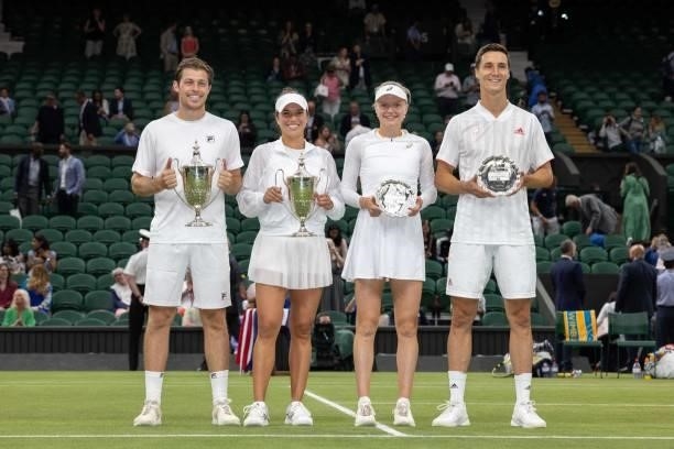 Winners Britain's Neal Skupski and US player Desirae Krawczyk and second place Britain's Joe Salisbury and Harriet Dart hold their trophies after the...