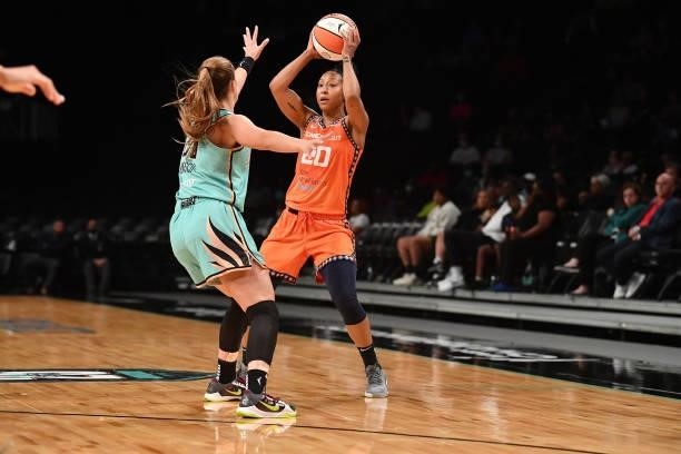 Sabrina Ionescu of the New York Liberty plays defense on Briann January of the Connecticut Sun on July 11, 2021 at the Barclays Center in Brooklyn,...