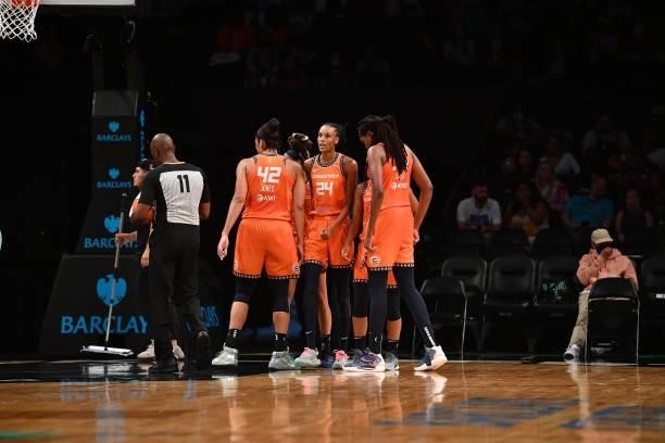 The Connecticut Sun huddle up during the game against the New York Liberty on July 11, 2021 at the Barclays Center in Brooklyn, New York. NOTE TO...