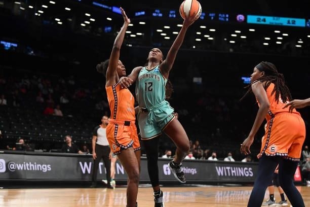 Michaela Onyenwere of the New York Liberty drives to the basket against the Connecticut Sun on July 11, 2021 at the Barclays Center in Brooklyn, New...