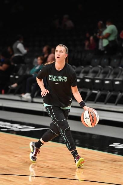 Sabrina Ionescu of the New York Liberty handles the ball before the game against the Connecticut Sun on July 11, 2021 at the Barclays Center in...