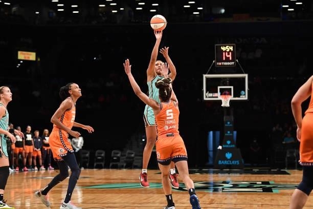 Betnijah Laney of the New York Liberty shoots the ball over Jasmine Thomas of the Connecticut Sun on July 11, 2021 at the Barclays Center in...