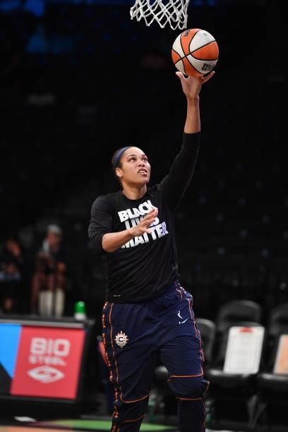 Brionna Jones of the Connecticut Sun drives to the basket before the game against the New York Liberty on July 11, 2021 at the Barclays Center in...