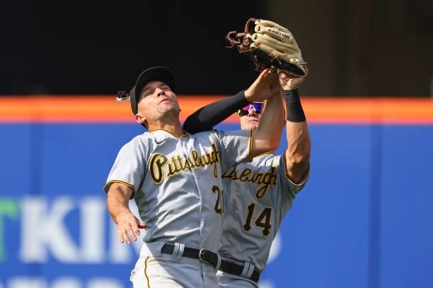 Second baseman Adam Frazier and right fielder Jared Oliva of the Pittsburgh Pirates collide after Oliva makes the catch on a ball hit by Francisco...