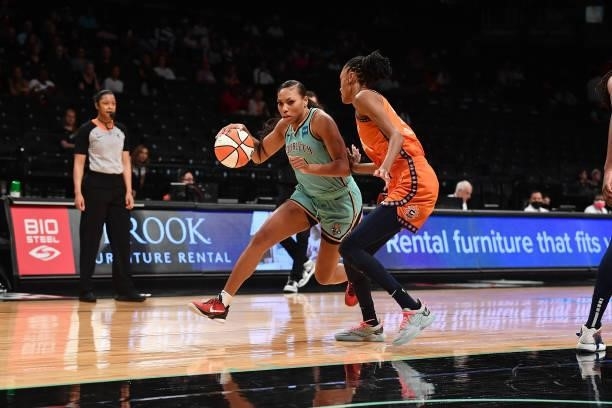 Betnijah Laney of the New York Liberty drives to the basket against the Connecticut Sun on July 11, 2021 at the Barclays Center in Brooklyn, New...