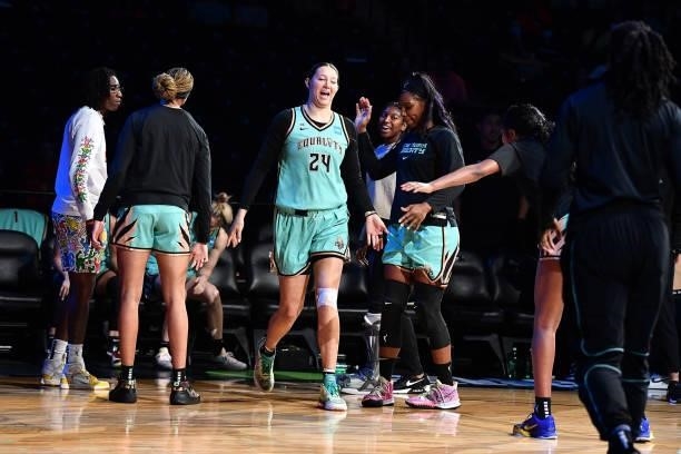 Kylee Shook of the New York Liberty high fives teammates before the game against the Connecticut Sun on July 11, 2021 at the Barclays Center in...