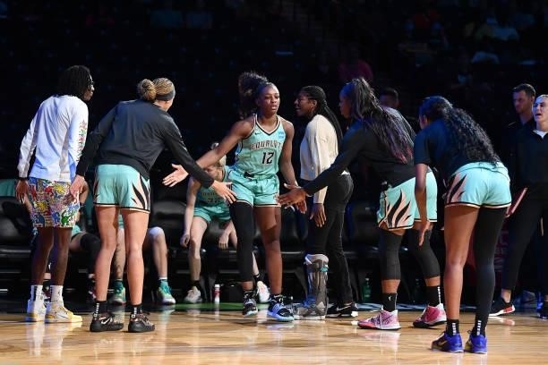 Michaela Onyenwere of the New York Liberty high fives teammates before the game against the Connecticut Sun on July 11, 2021 at the Barclays Center...