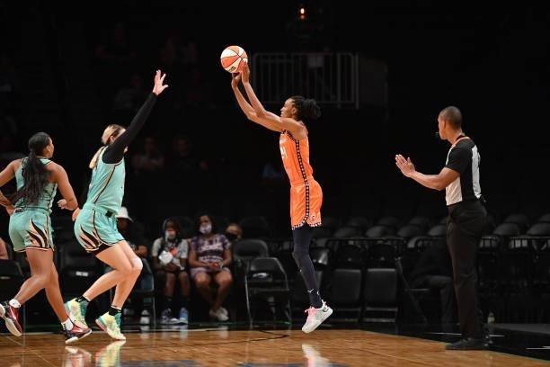 DeWanna Bonner of the Connecticut Sun shoots the ball over Sami Whitcomb of the New York Liberty on July 11, 2021 at the Barclays Center in Brooklyn,...