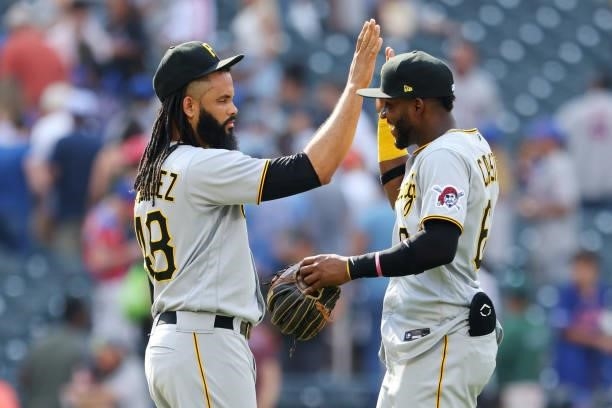 Closer Richard Rodriguez of the Pittsburgh Pirates high fives Rodolfo Castro after the Pirates defeated the Mets 6-5 at Citi Field on July 11, 2021...
