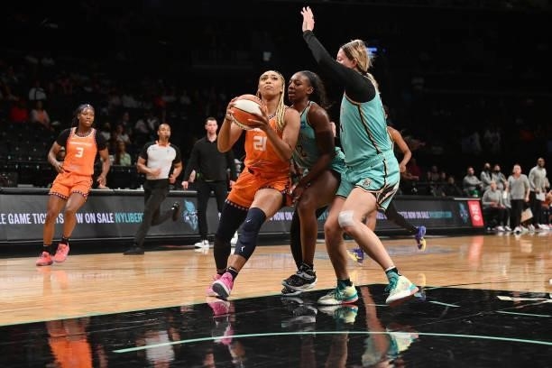 DiJonai Carrington of the Connecticut Sun drives to the basket against the New York Liberty on July 11, 2021 at the Barclays Center in Brooklyn, New...