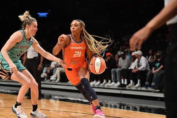DiJonai Carrington of the Connecticut Sun dribbles the ball against the New York Liberty on July 11, 2021 at the Barclays Center in Brooklyn, New...