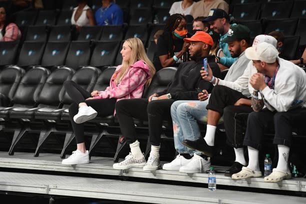 Bruce Brown of the Brooklyn Nets and UConn Huskies player, Paige Bueckers attend the game between the Connecticut Sun and the New York Liberty on...