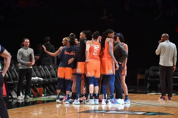 The Connecticut Sun huddle up after the game against the New York Liberty on July 11, 2021 at the Barclays Center in Brooklyn, New York. NOTE TO...
