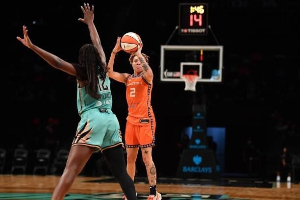 Natisha Hiedeman of the Connecticut Sun shoots the ball over Michaela Onyenwere of the New York Liberty on July 11, 2021 at the Barclays Center in...