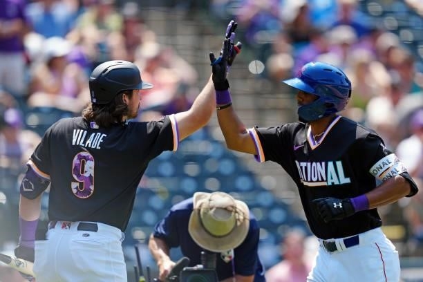Brennen Davis of the National League Team is greeted by teammate Ryan Vilade after hitting a solo home run in the fourth inning during the 2021...