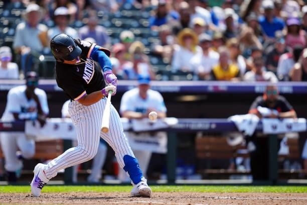 Francisco Alvarez of the National League Team hits a solo home run in the sixth inning during the 2021 Sirius XM Futures Game at Coors Field on...