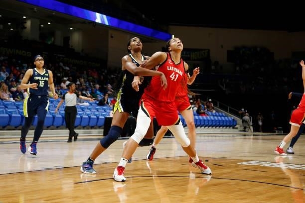 Kiah Stokes of the Las Vegas Aces and Charli Collier of the Dallas Wings look up on July 11, 2021 at the College Park Center in Arlington, TX. NOTE...