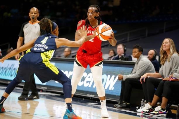 Riquna Williams of the Las Vegas Aces handles the ball against the Dallas Wings on July 11, 2021 at the College Park Center in Arlington, TX. NOTE TO...