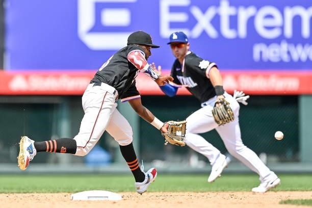 Marco Luciano of National League Futures Team fields a ground ball against the American League Futures Team at Coors Field on July 11, 2021 in...