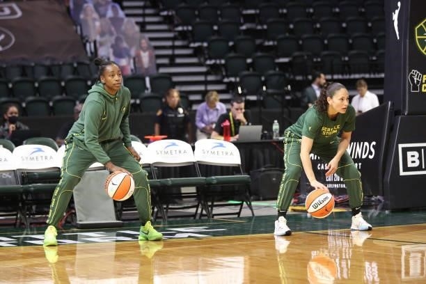 Jewell Loyd and Sue Bird of the Seattle Storm warm up before the game against the Phoenix Mercury on July 11, 2021 at the Angel of the Winds Arena,...