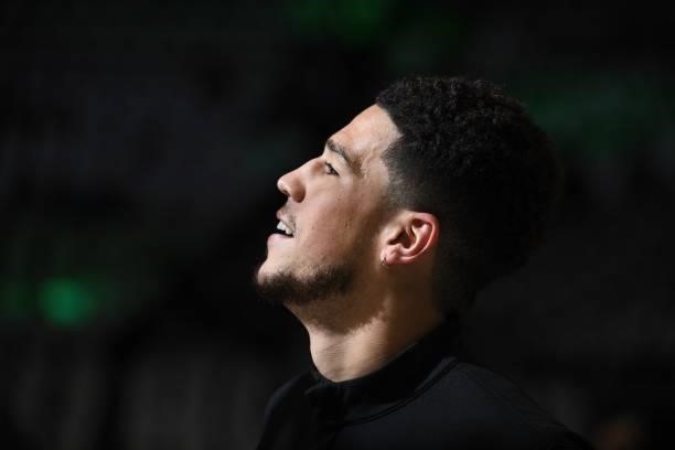 July 11: Devin Booker of the Phoenix Suns looks on and smiles before Game Three of the 2021 NBA Finals on July 11, 2021 at the Fiserv Forum Center in...