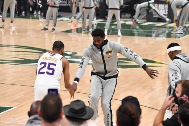 Mikal Bridges of the Phoenix Suns and Deandre Ayton of the Phoenix Suns high-five before Game Three of the 2021 NBA Finals on July 11, 2021 at Fiserv...
