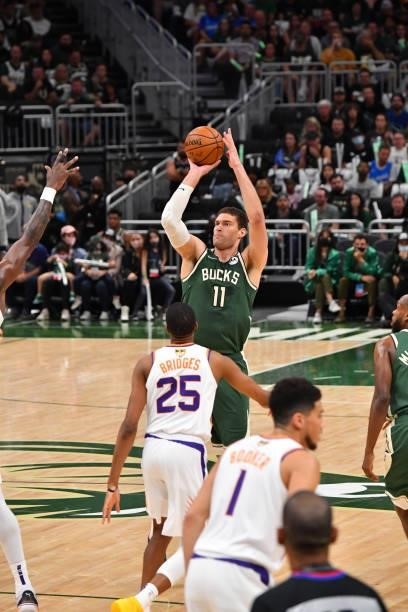 Brook Lopez of the Milwaukee Bucks shoots the ball against the Phoenix Suns during Game Three of the 2021 NBA Finals on July 11, 2021 at Fiserv Forum...