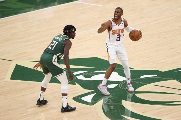 Chris Paul of the Phoenix Suns handles the ball during the game against Jrue Holiday of the Milwaukee Bucks during Game Three of the 2021 NBA Finals...