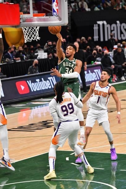 Giannis Antetokounmpo of the Milwaukee Bucks passes the ball against the Phoenix Suns during Game Three of the 2021 NBA Finals on July 11, 2021 at...